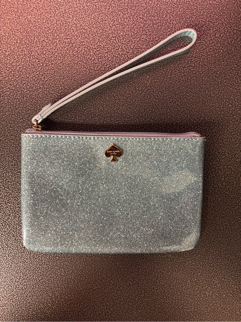 kate spade Silver Glitter Wristlet with Pink Trim and Strap